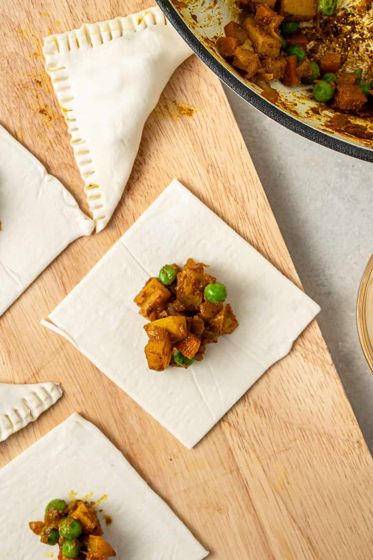 The filling in a square of pastry to make the pastries. 