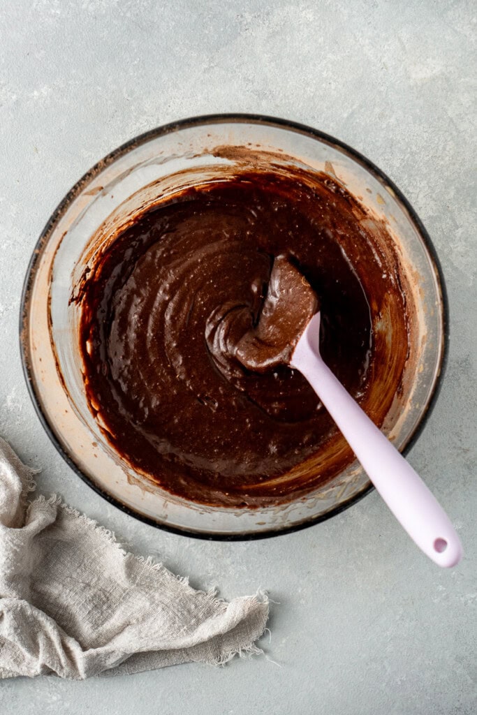 The thick and glossy dairy free brownie batter in a bowl.