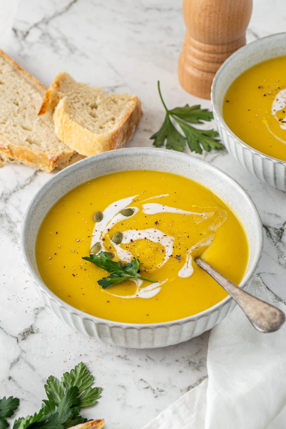 The pumpkin soup served into bowls.
