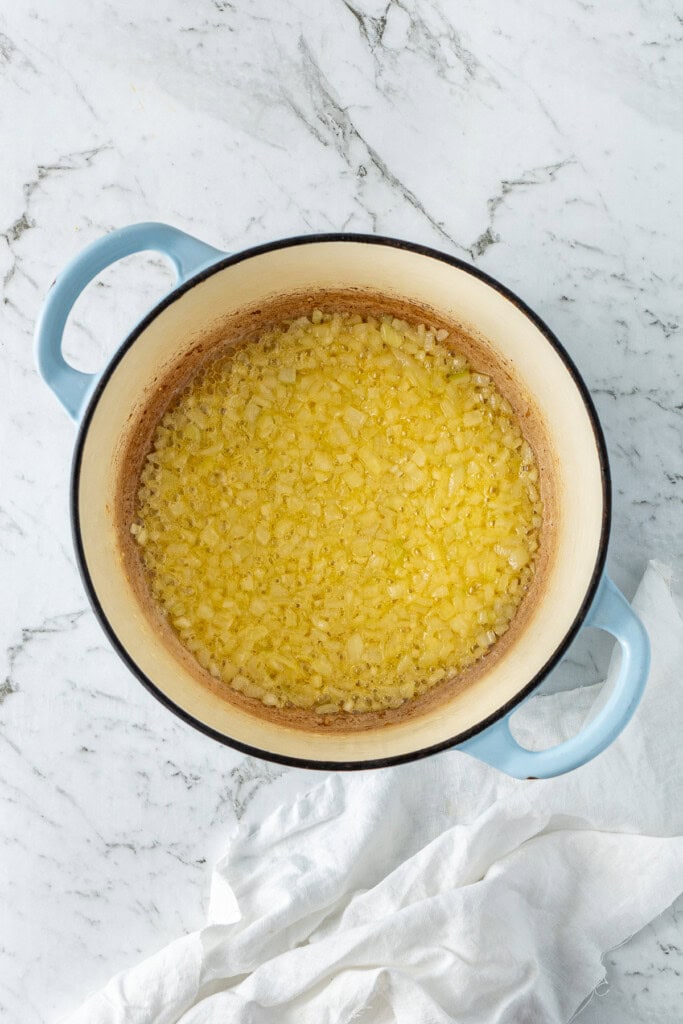 Cooking the onions in the pot with the dairy free butter.
