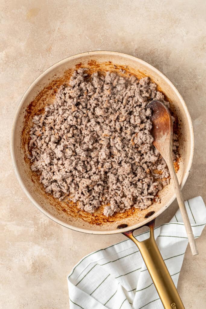 Frying off the pork mince in a pan.