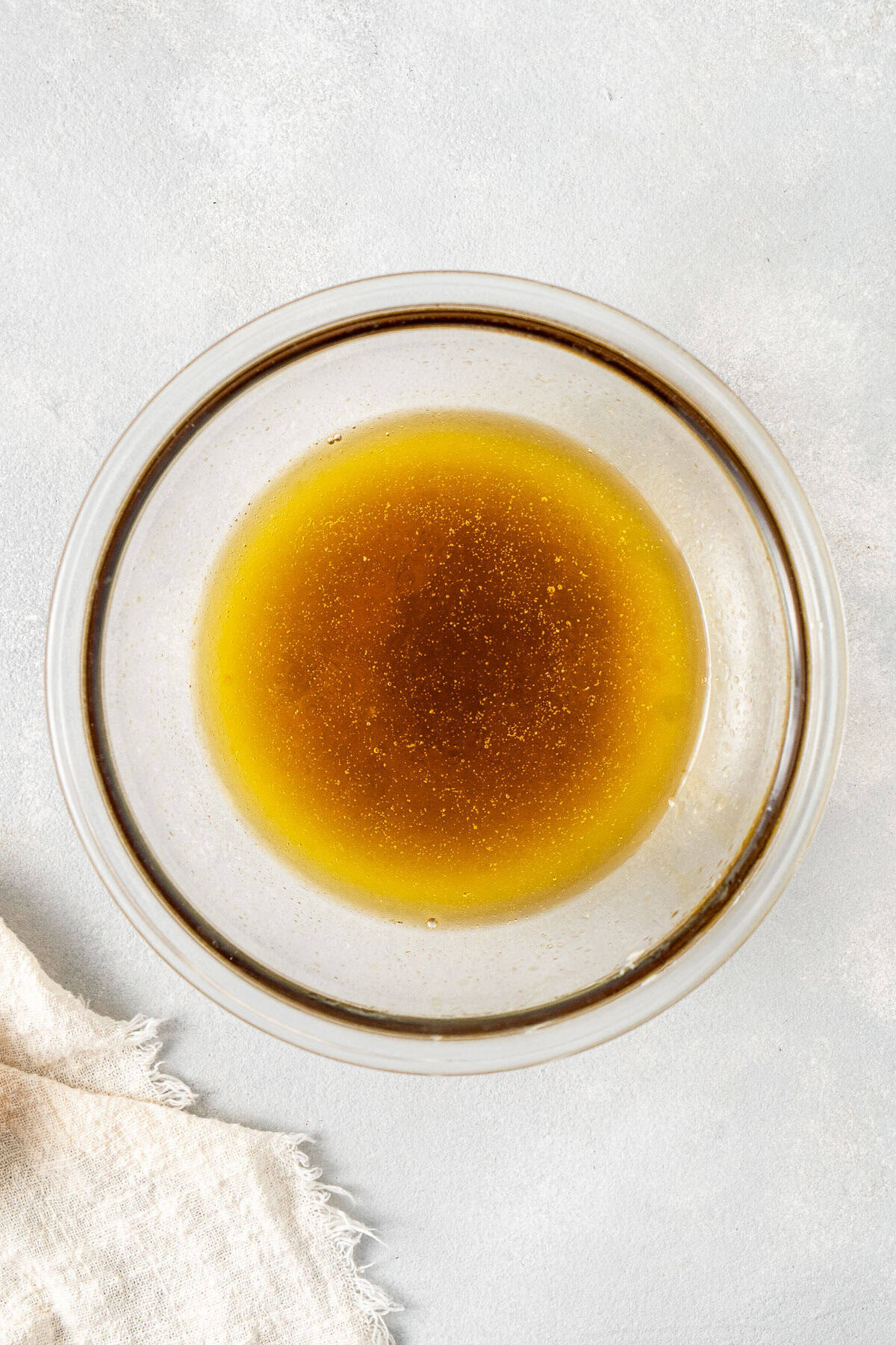 Melted dairy free butter and golden syrup in a bowl.