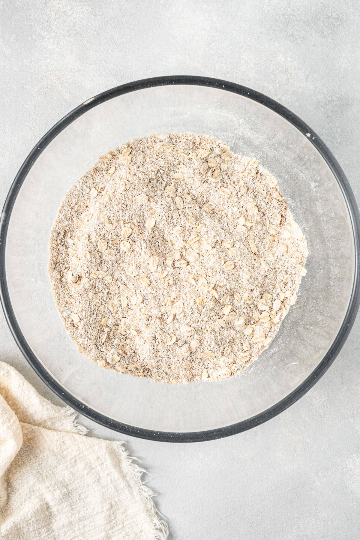 All dry ingredients mixed together in a glass bowl.