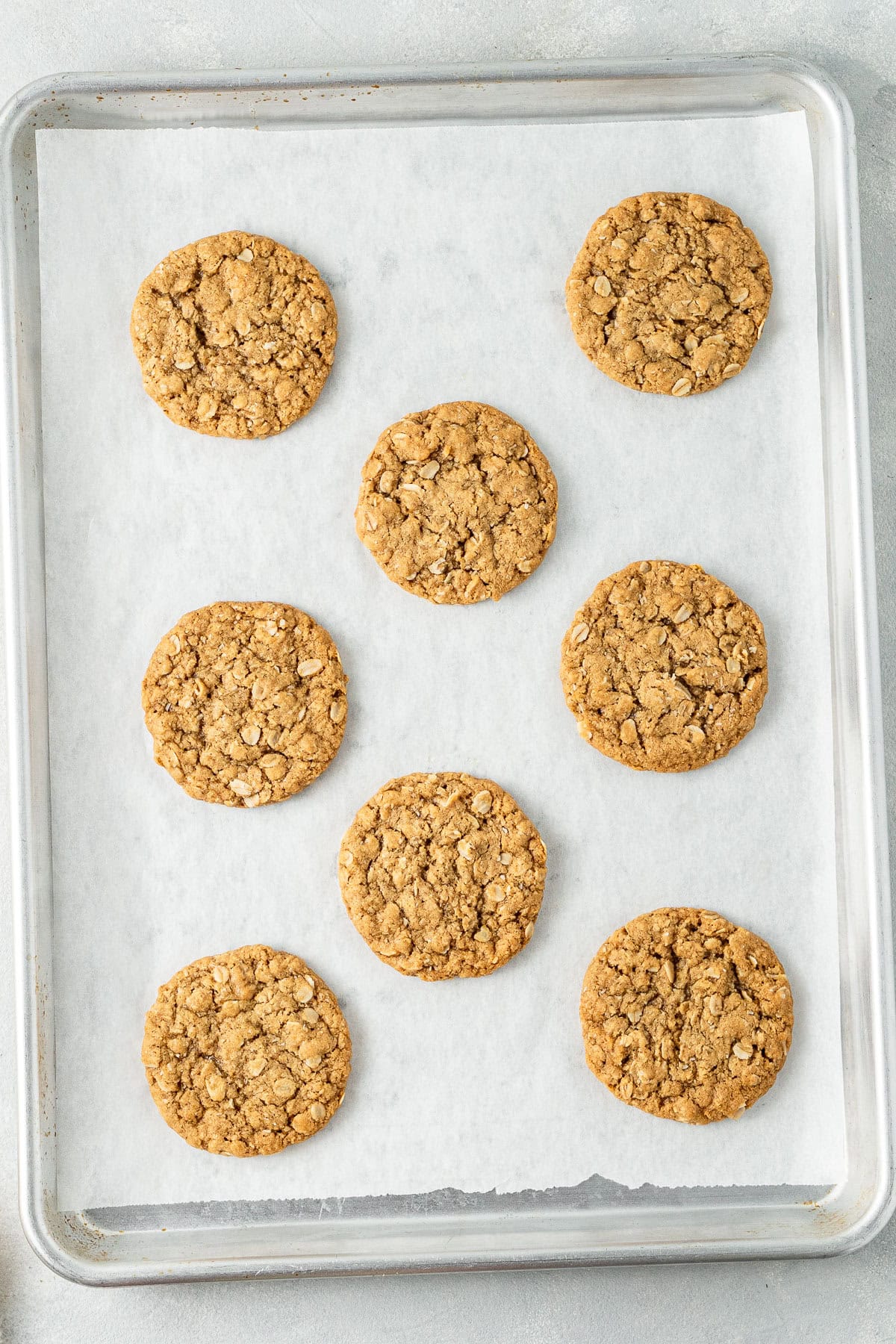 The cooked biscuits on a baking tray.
