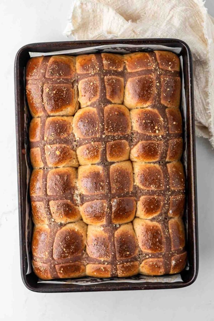 Savoury hot cross buns freshly baked and golden brown.