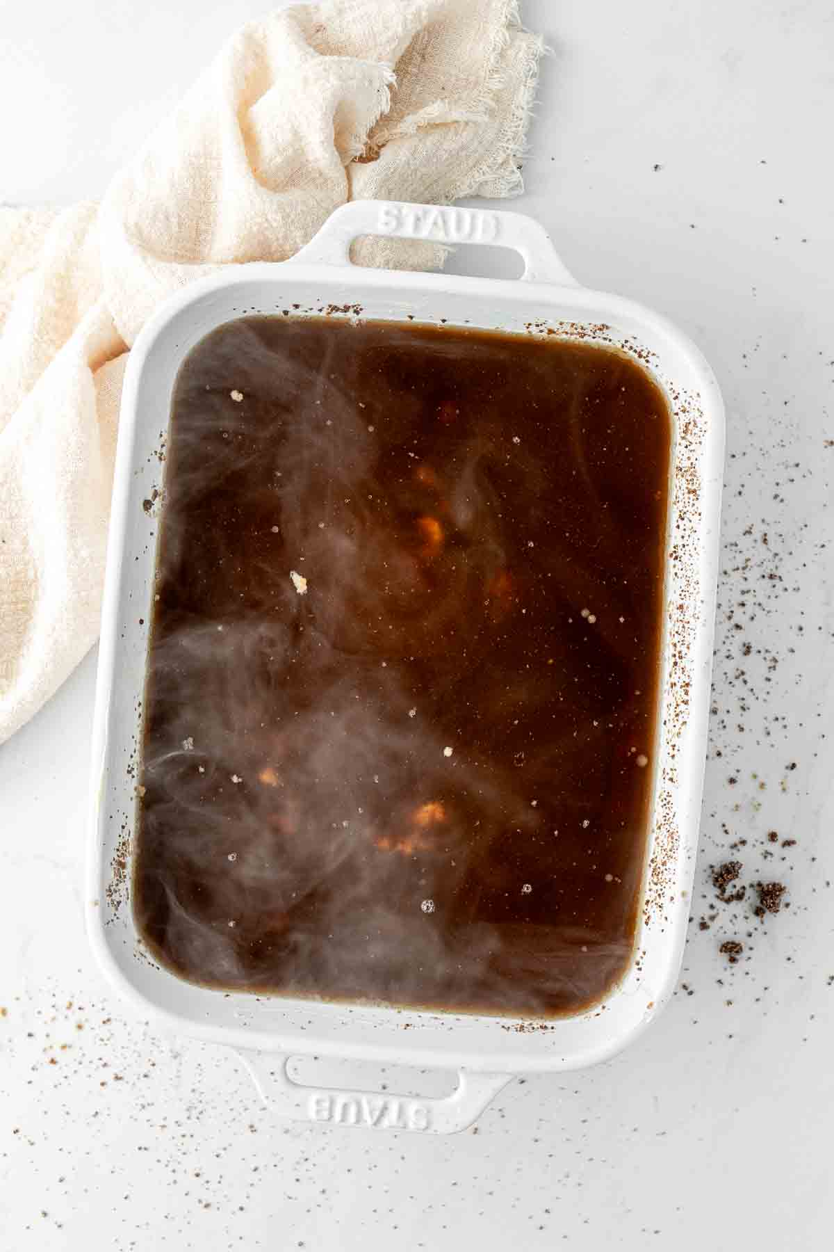 Boiling water added to the top of the pudding.