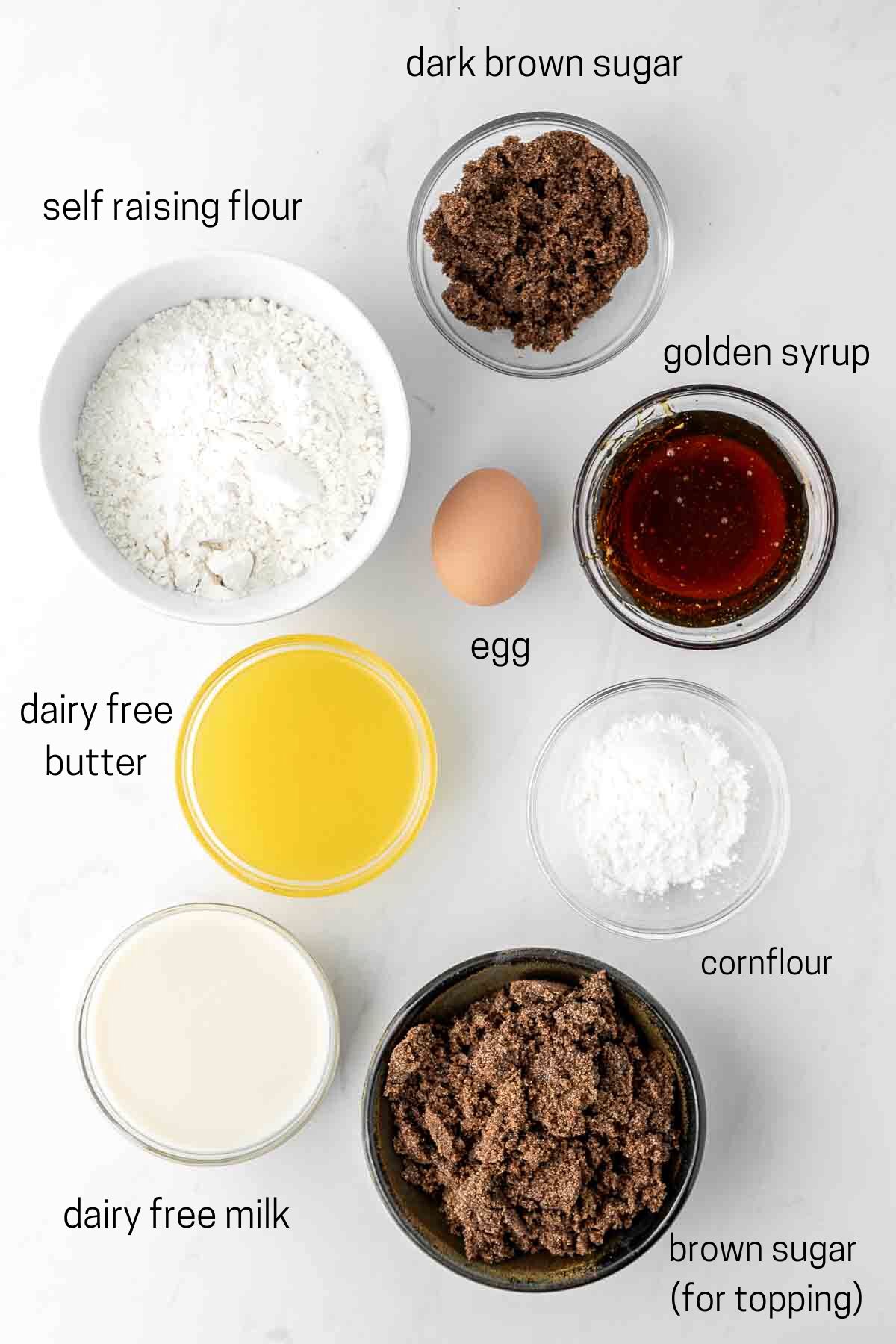 all ingredients needed to make butterscotch pudding laid out in small bowls.