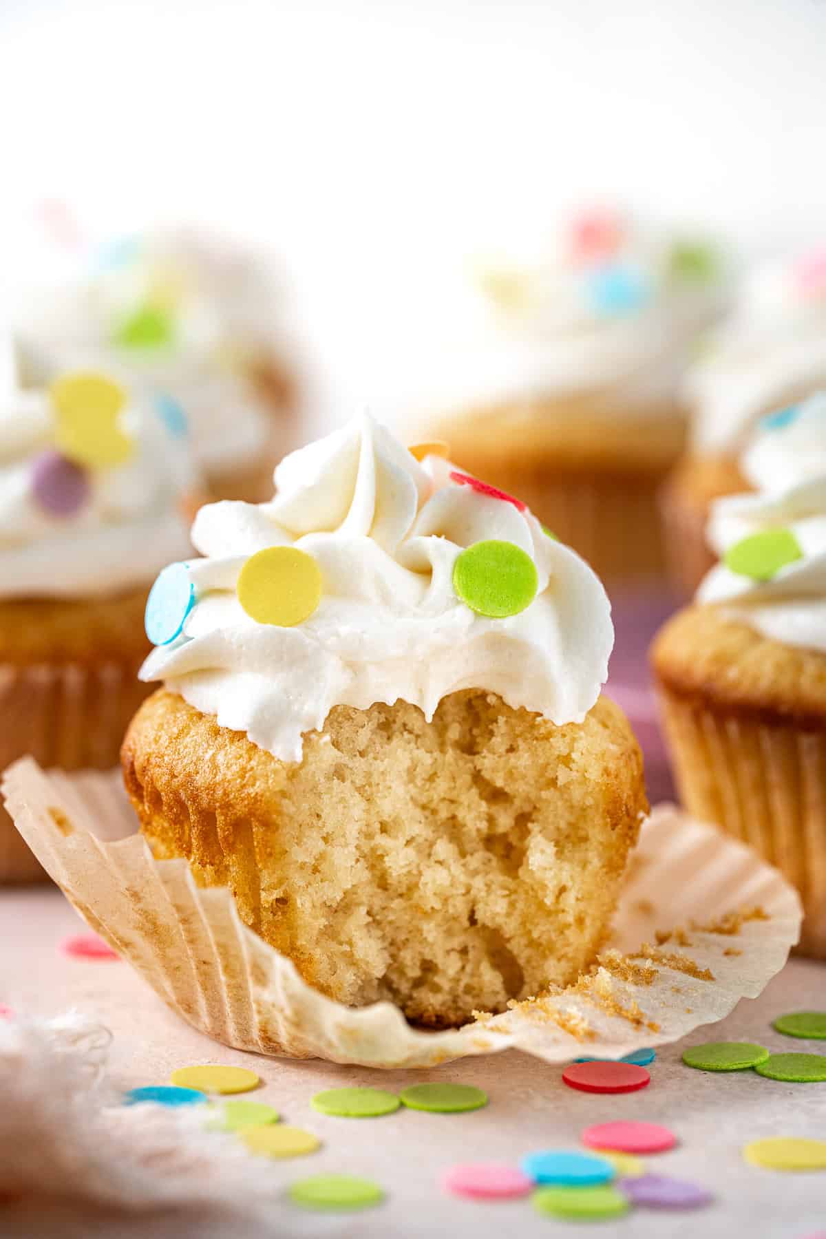 Dairy free cupcake with a bite taken.