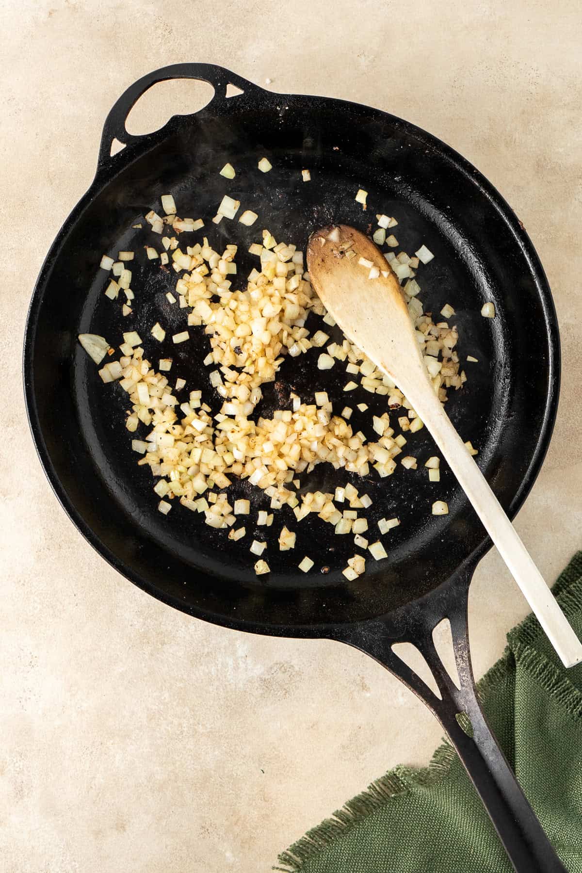 Cooking the onions in the pan.