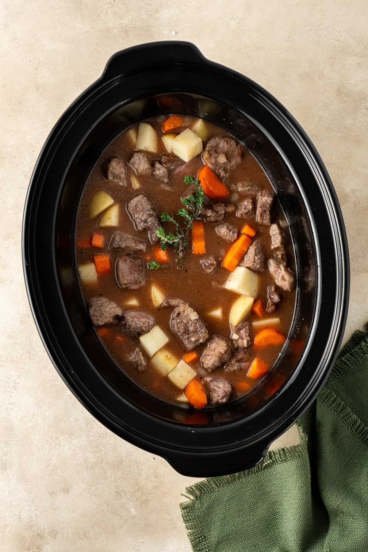 All the beef stew ingredients in the slow cooker.