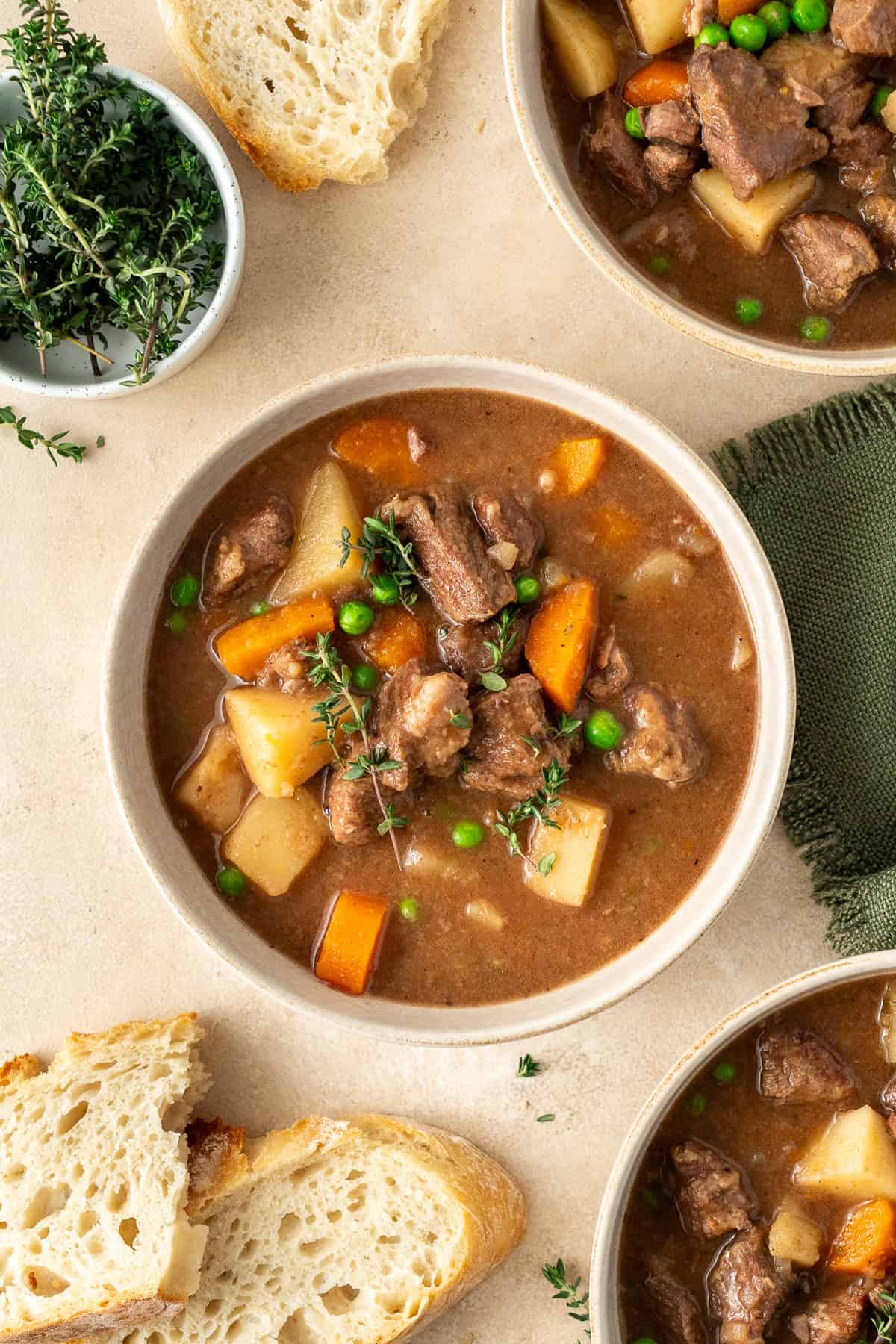 The slow cooker beef stew served into bowls.