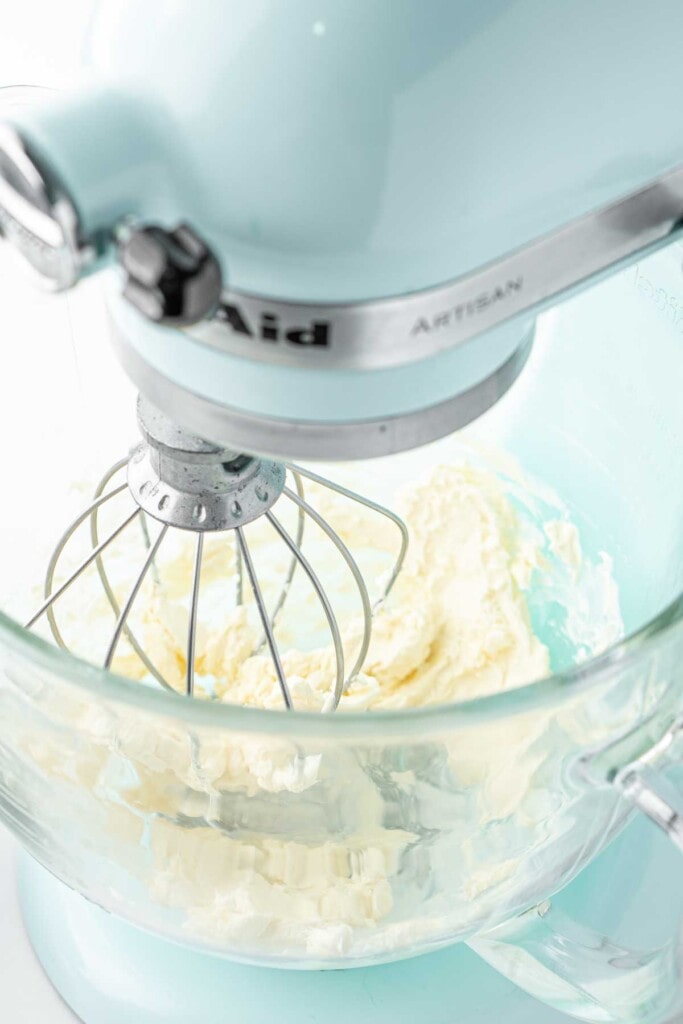 Beating together the dairy free butter and vanilla in a stand mixer.