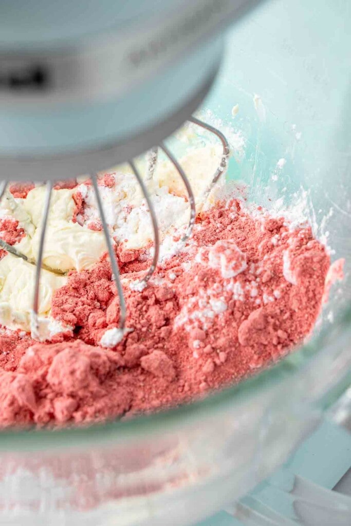 Freeze dried strawberry powder added to stand mixer to make buttercream.