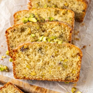Lemon pistachio cardamon loaf cake sliced.