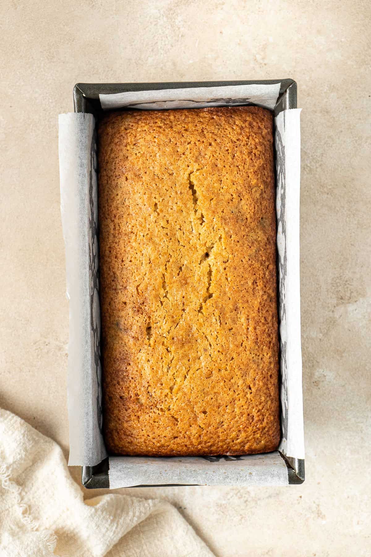 The cooked cake in a loaf pan.