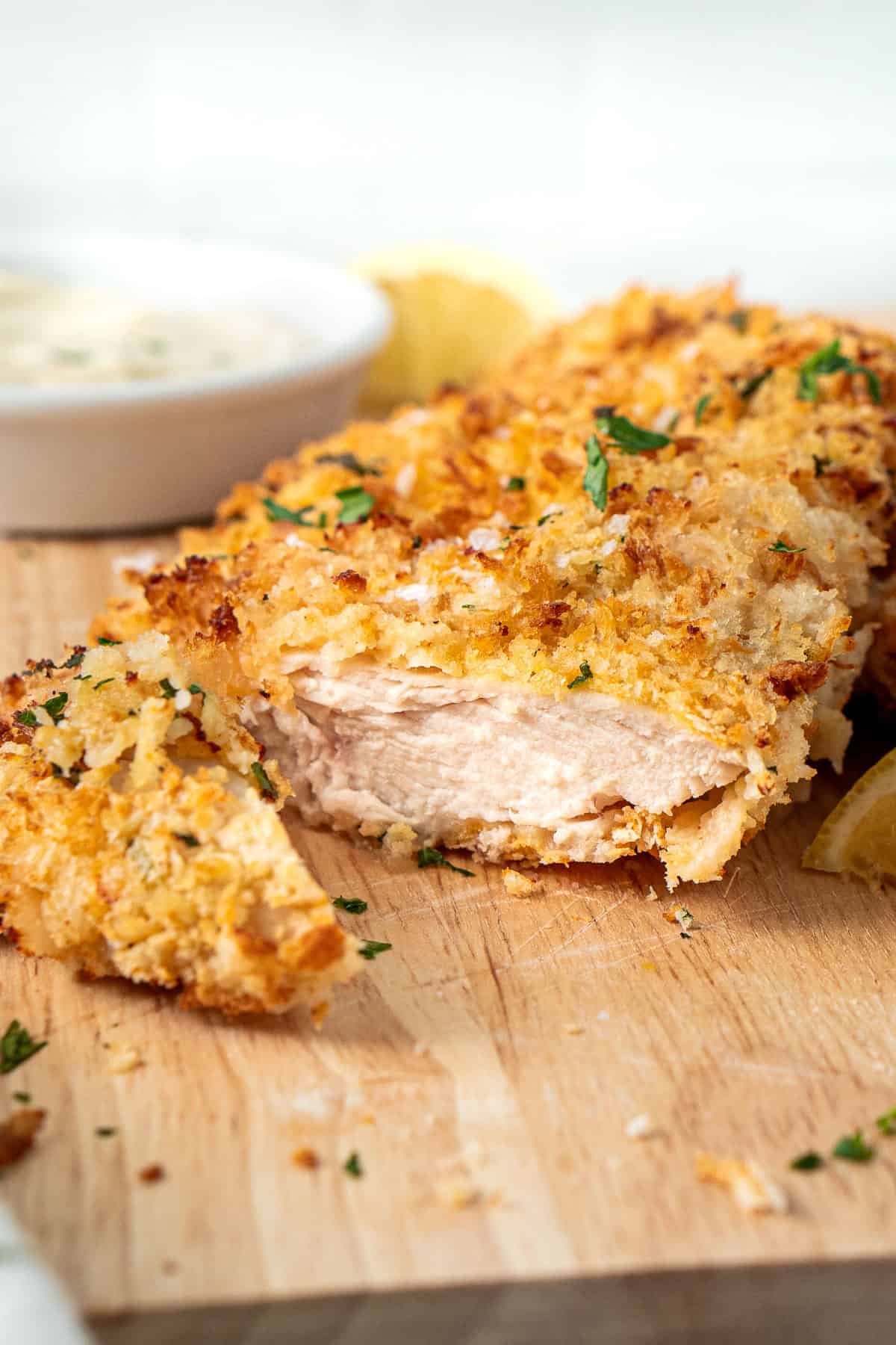 Close up of a chicken schnitzel cut open.