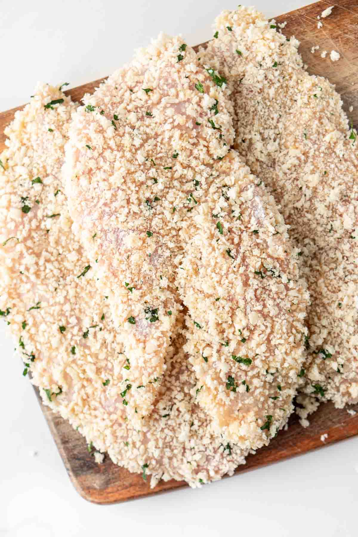 Crumbed chicken schnitzels ready for air-frying. 