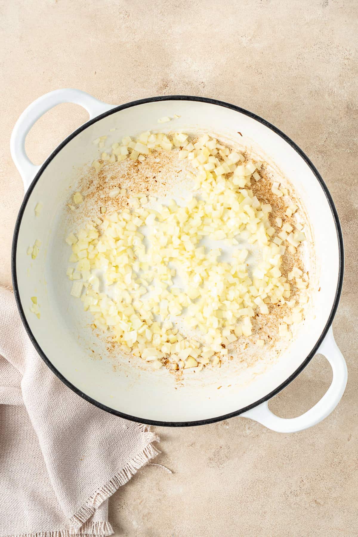 Chopped onion fried in a pot.