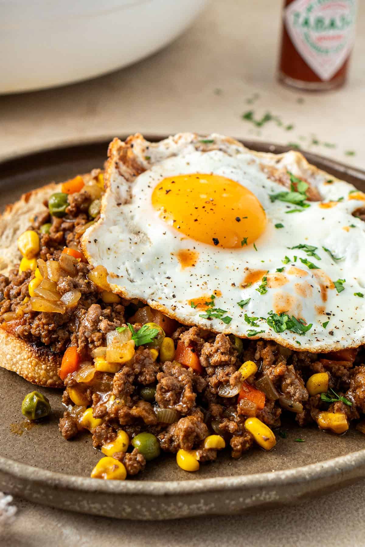 A fried egg over savoury mince on toast.