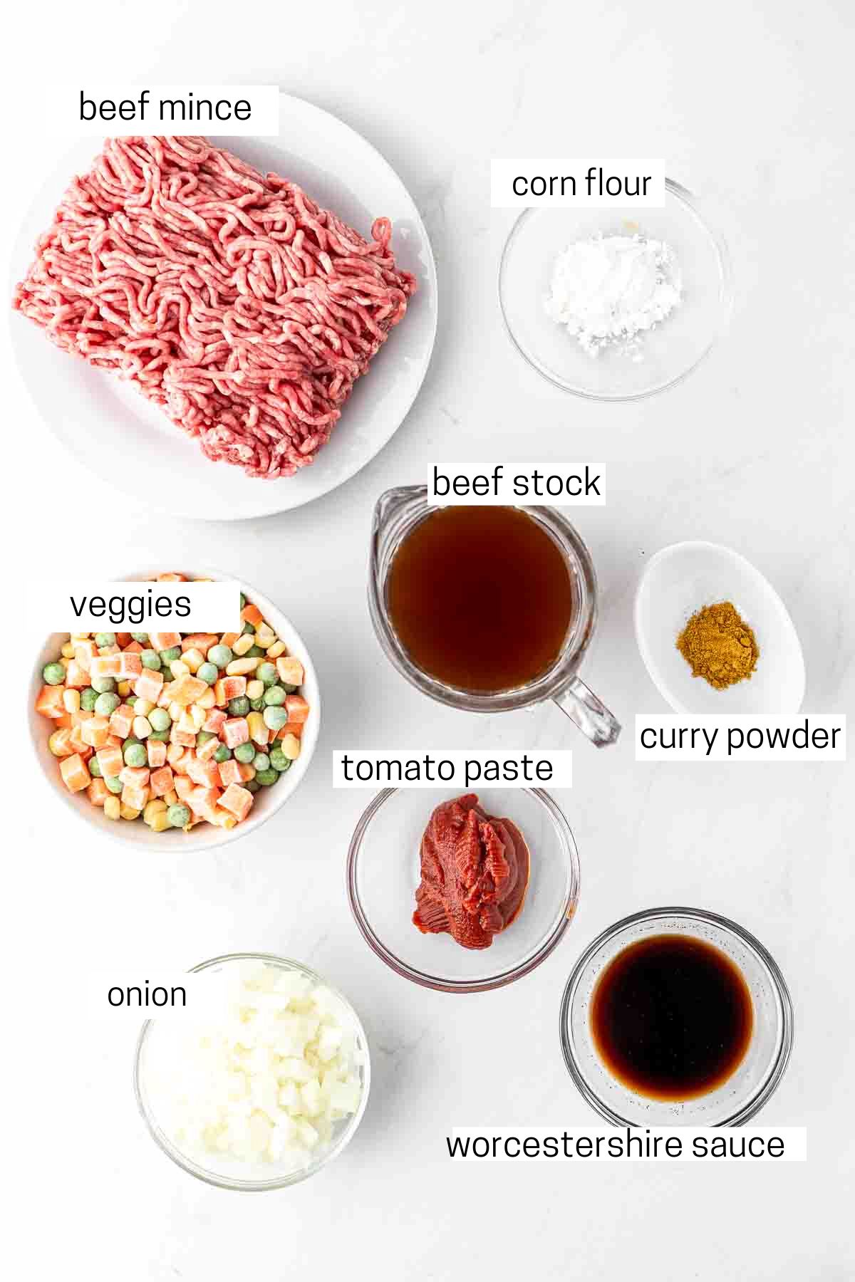 All ingredients needed for savoury mince laid out in bowls.