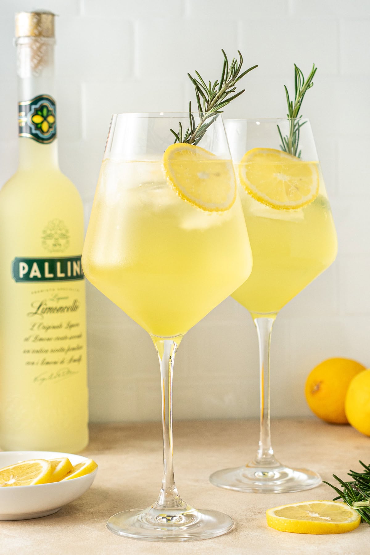 Limoncello spritz in a glass with garnish.