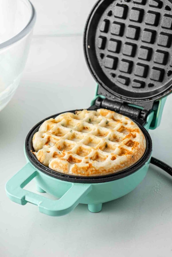 Cooking waffle in the waffle pan.