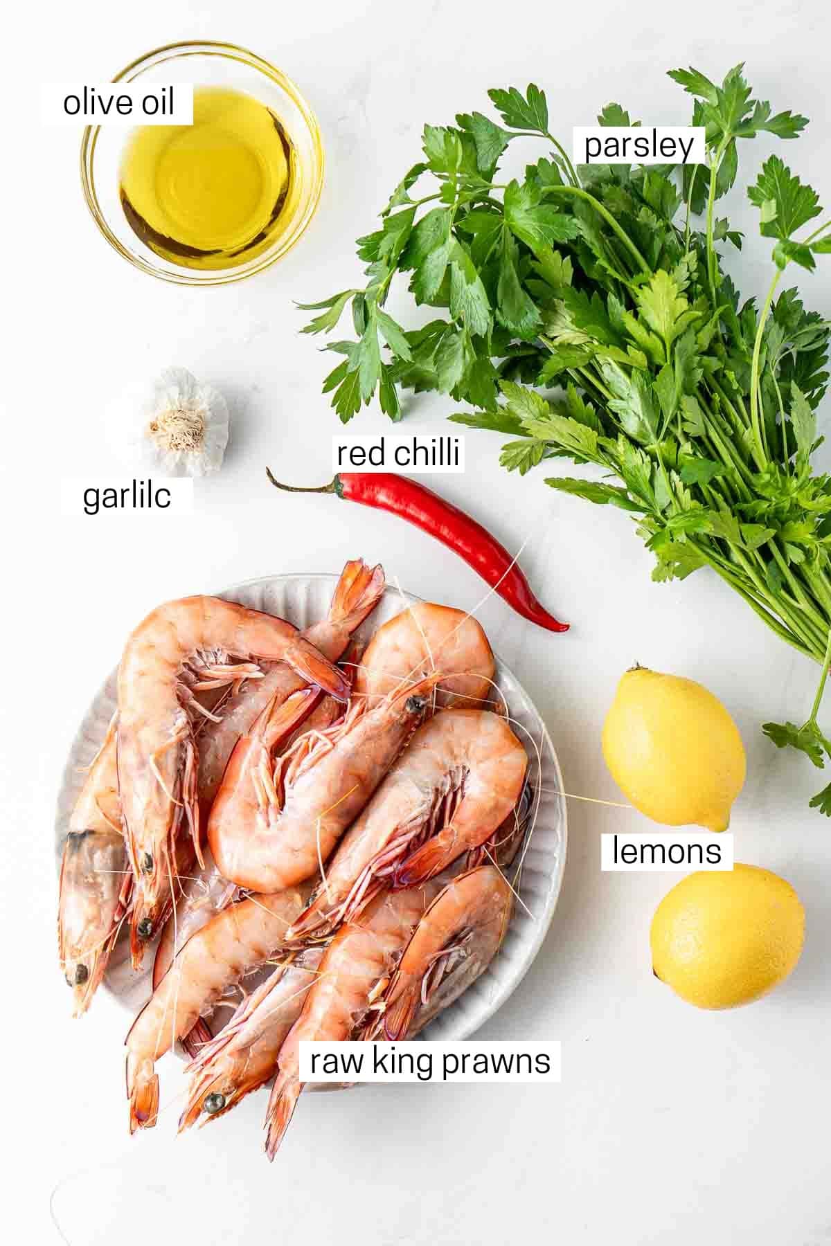 All ingredients needed to make grilled prawns laid out.