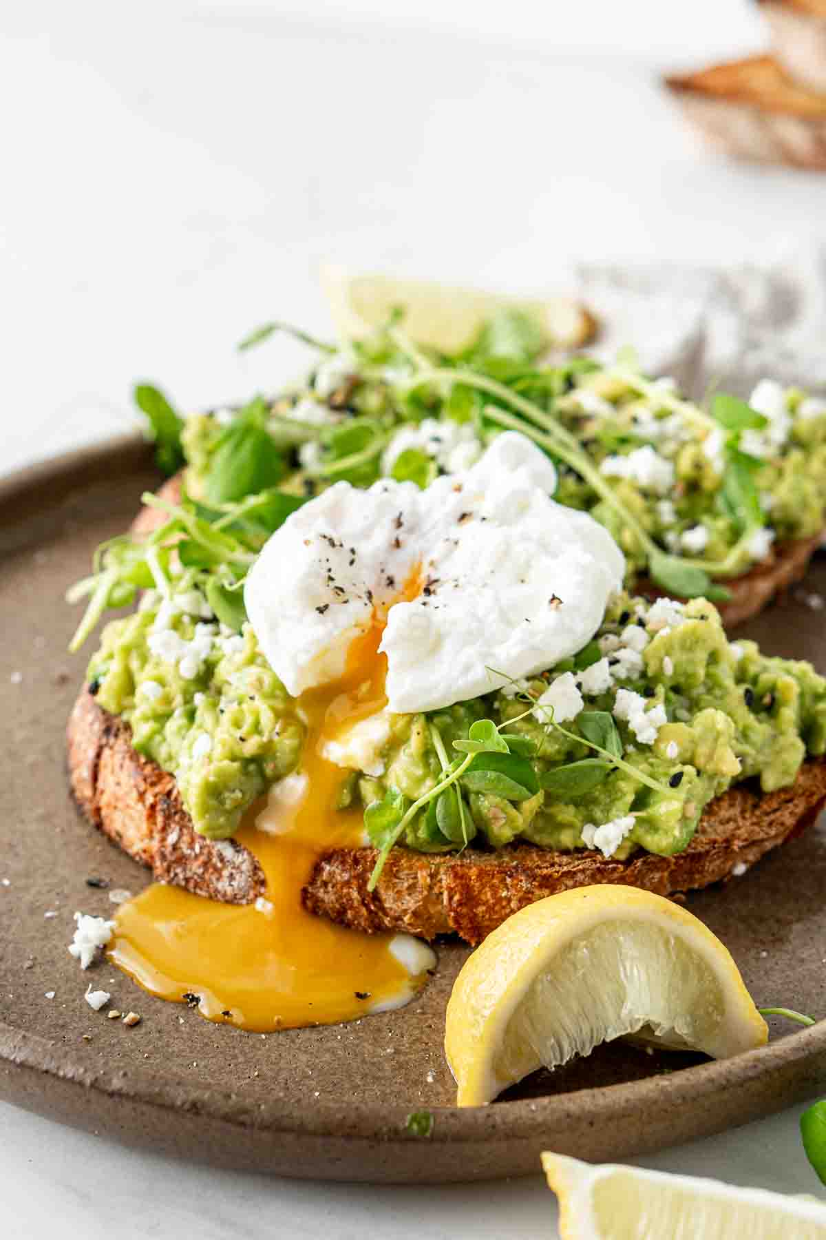 Poached egg on top of avocado toast.