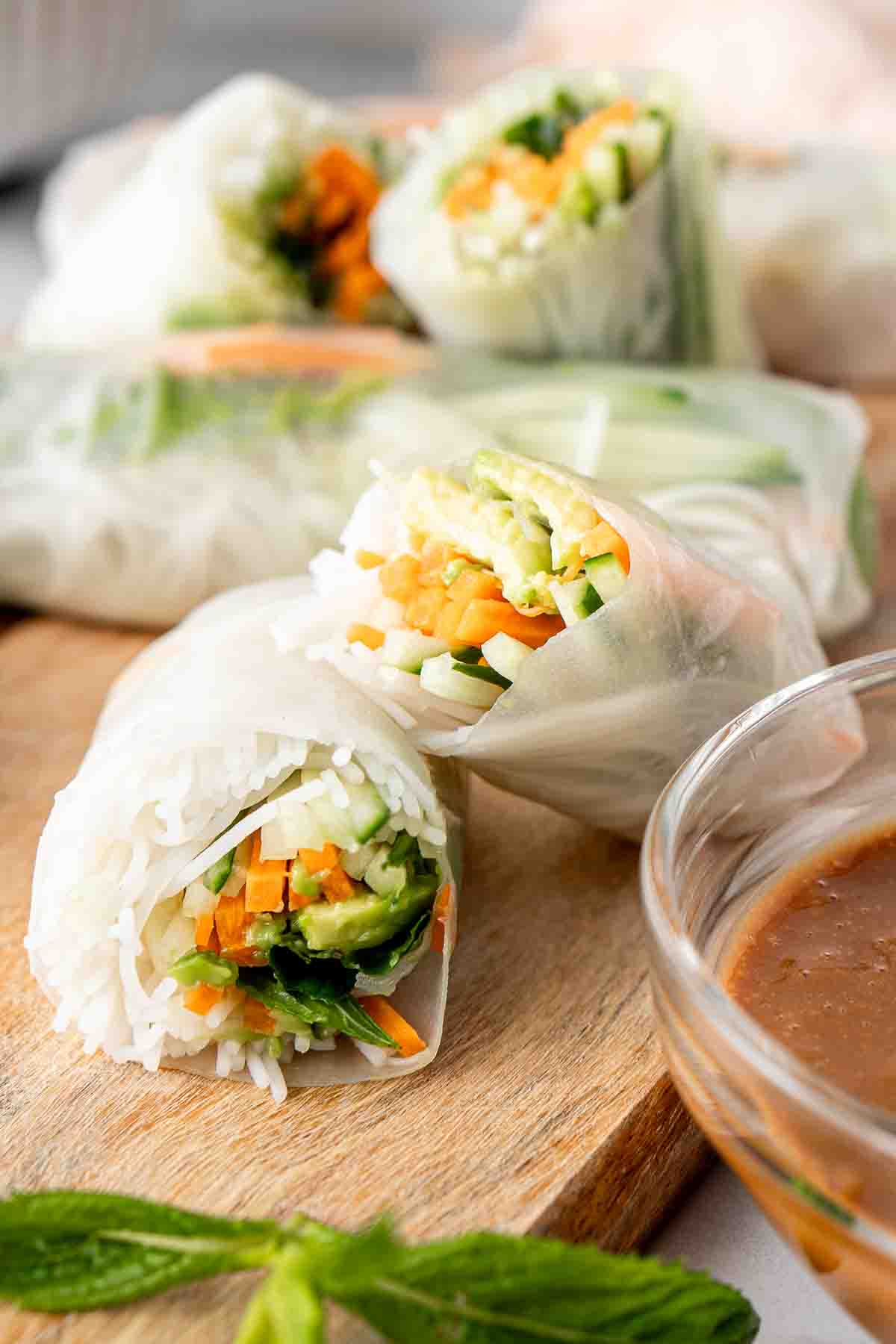 Close up of a fresh spring roll cut in half.
