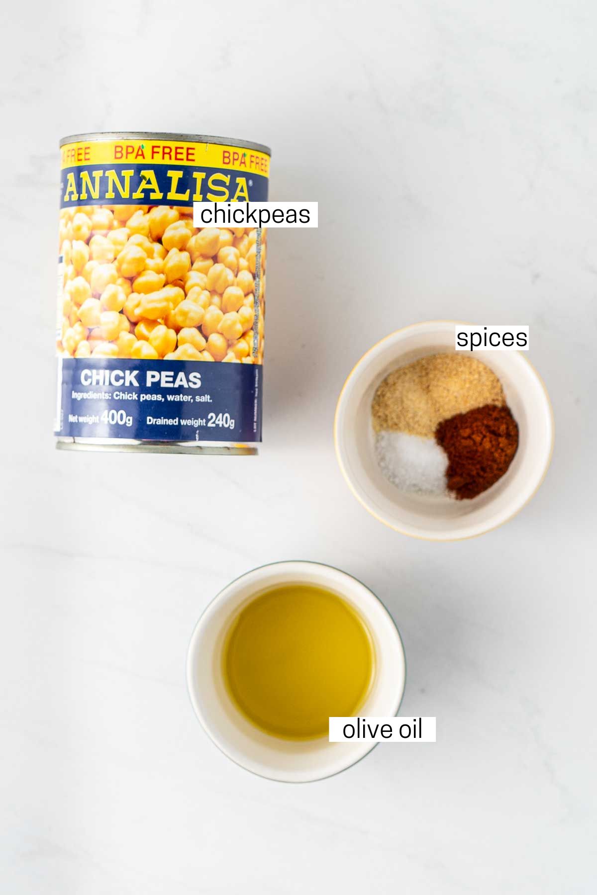 All ingredients needed for crispy air fryer chickpeas laid out in bowls.