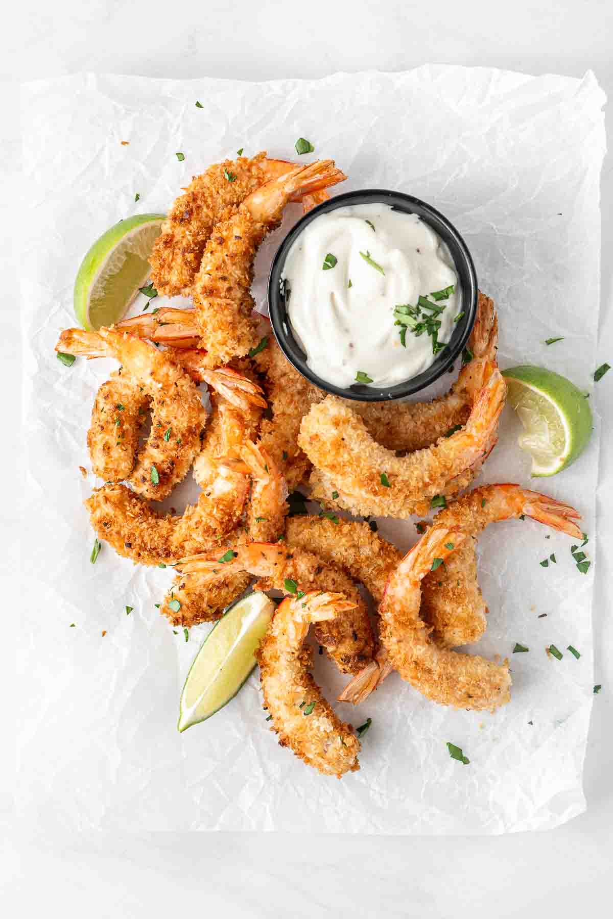 Coconut prawns with garlic aioli and lime wedges. 