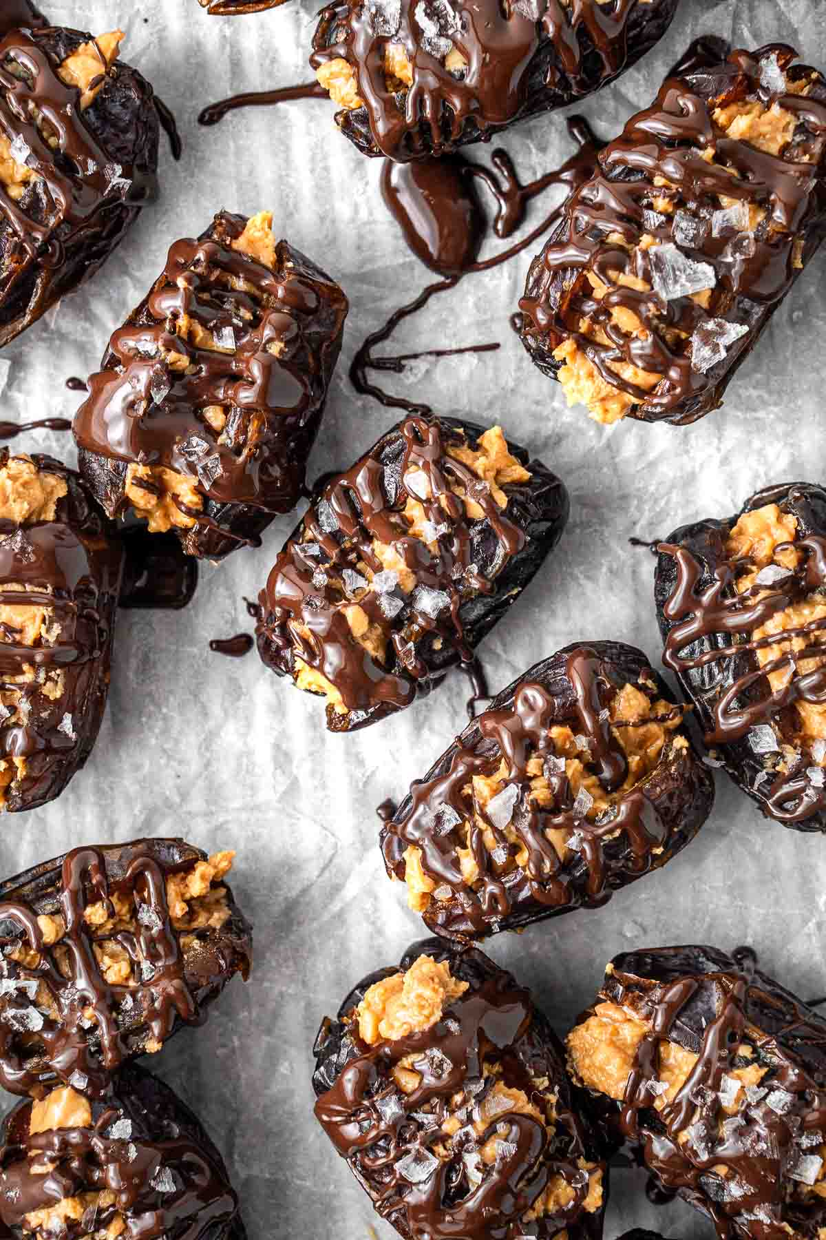 Peanut butter dates drizzled with dark chocolate and topped with sea salt.