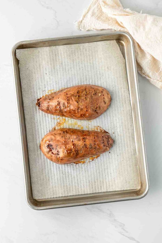 Roasted sweet potato on a baking tray.