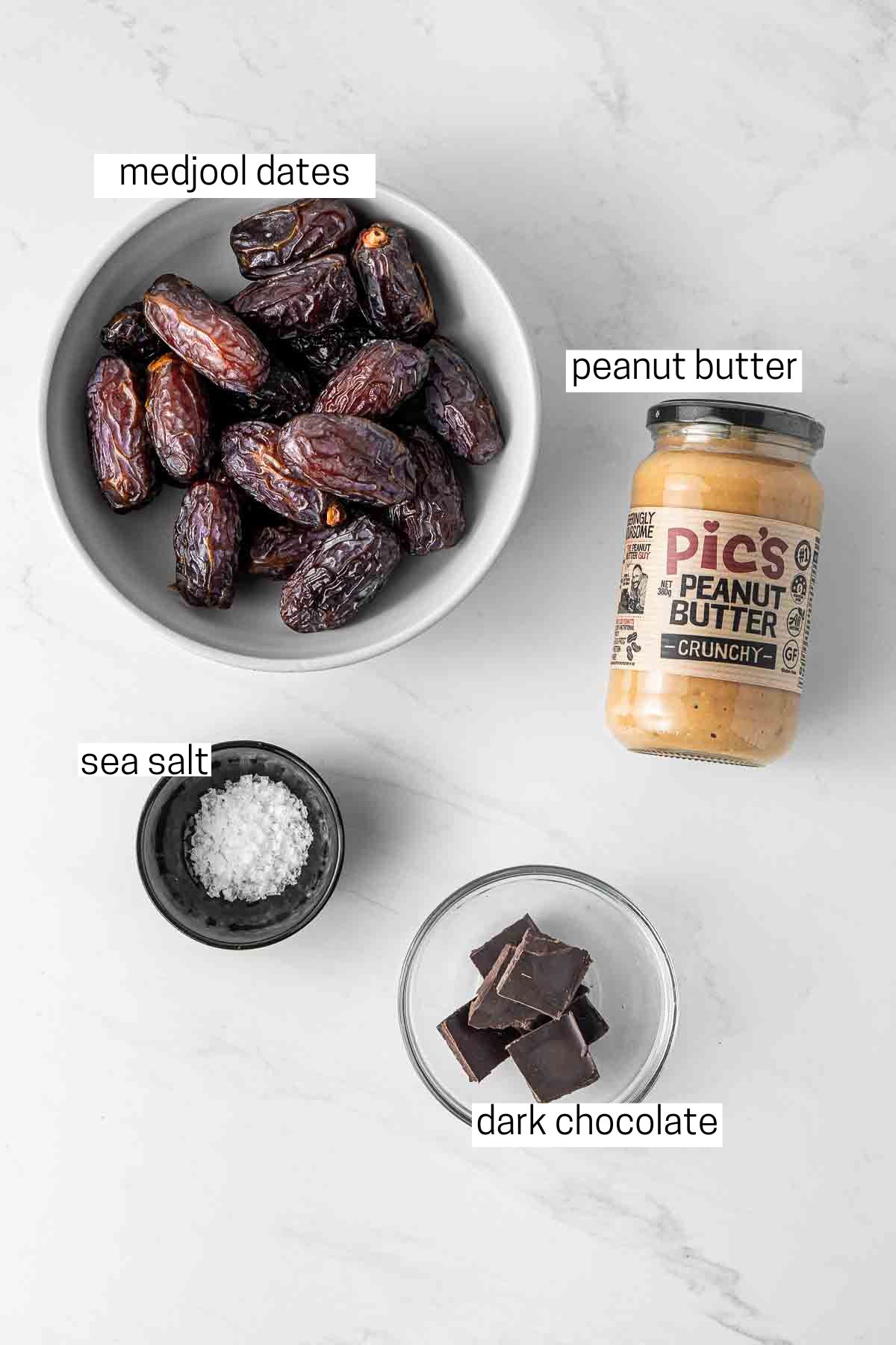 All ingredients needed to make peanut butter dates laid out in bowls.
