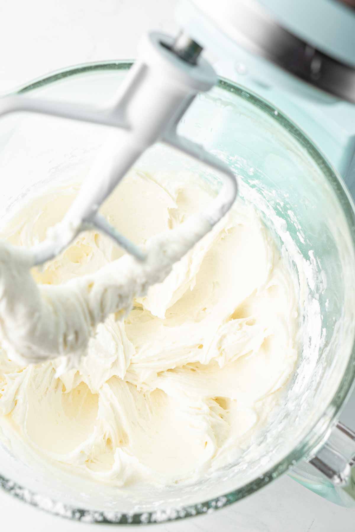Close up of coconut buttercream in a stand mixer.