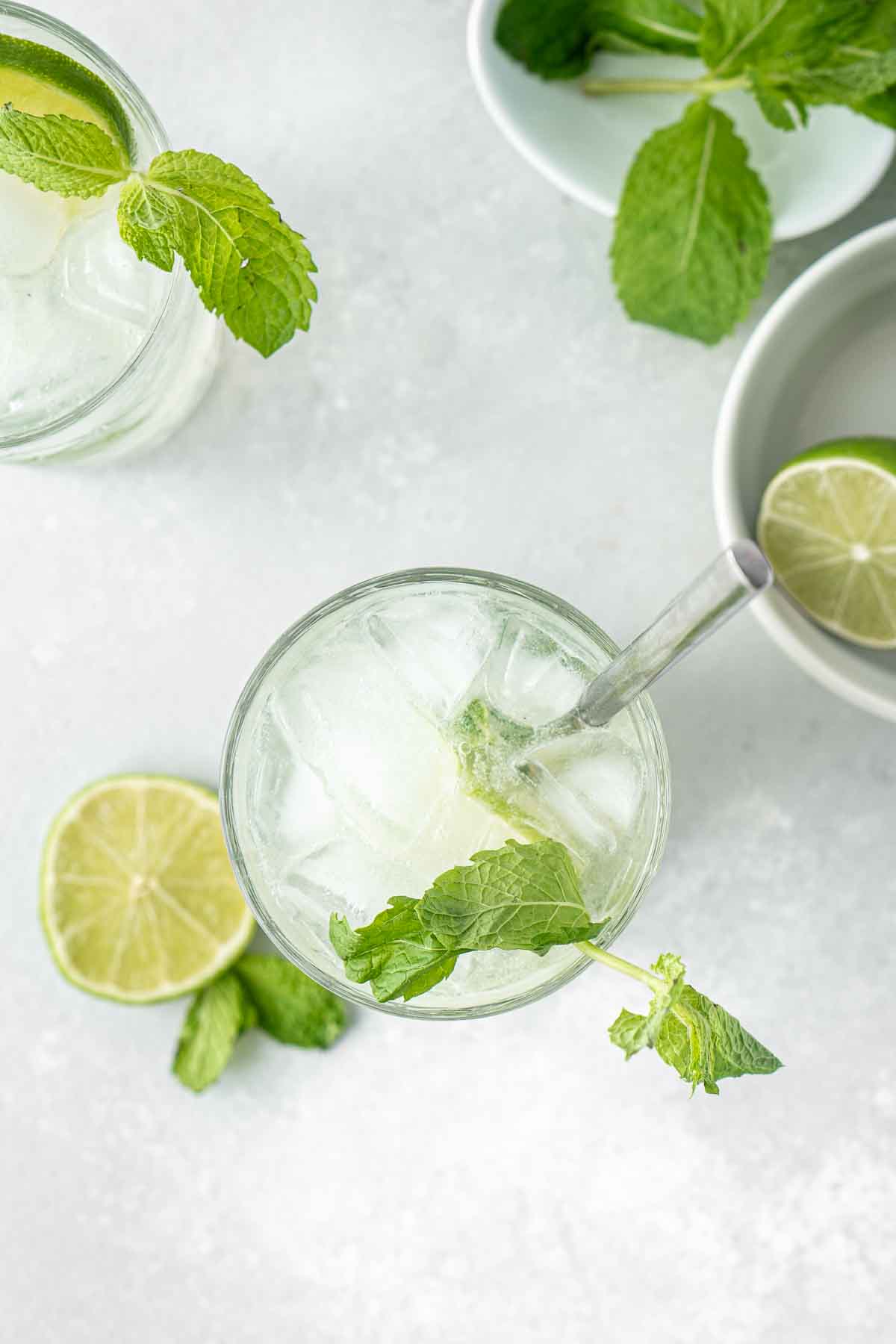 Overhead of the mojito mocktail with fresh lime and mint.