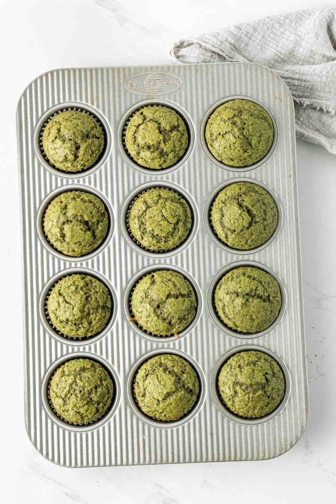 Cooked matcha cupcakes in a cupcake tray.