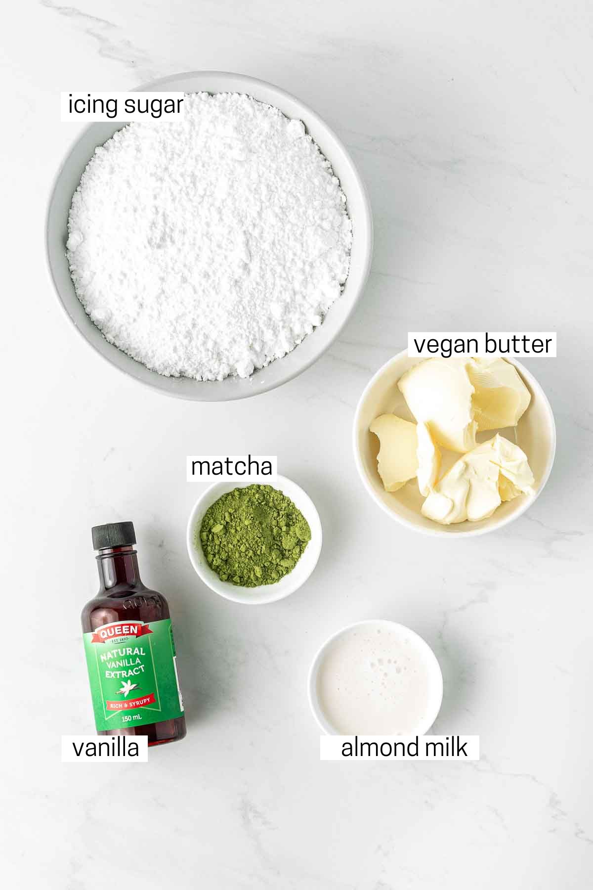 All ingredients needed for the matcha buttercream laid out in small bowls.