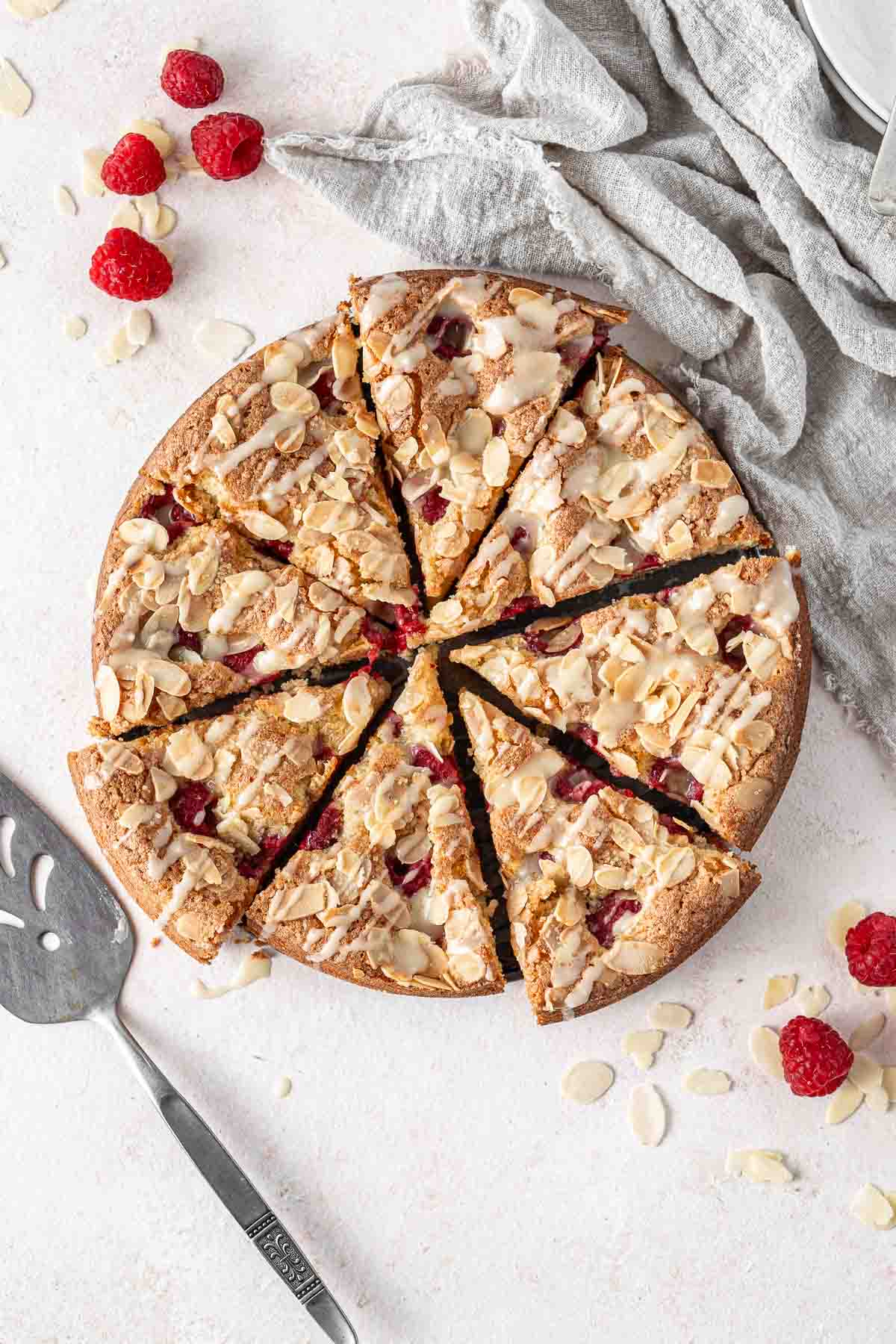 Almond and raspberry cake cut into slices.