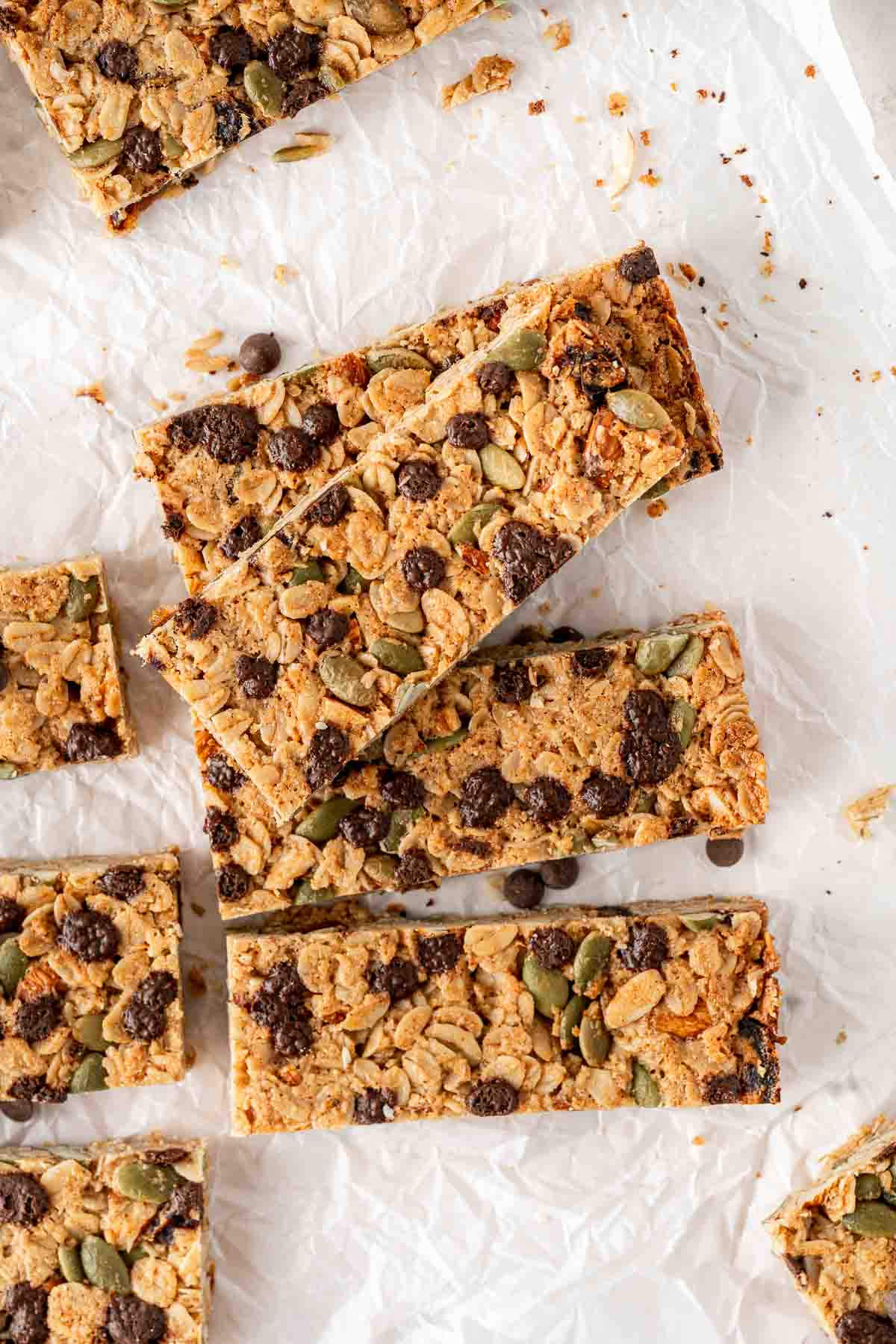 Granola bars laid out on baking paper.