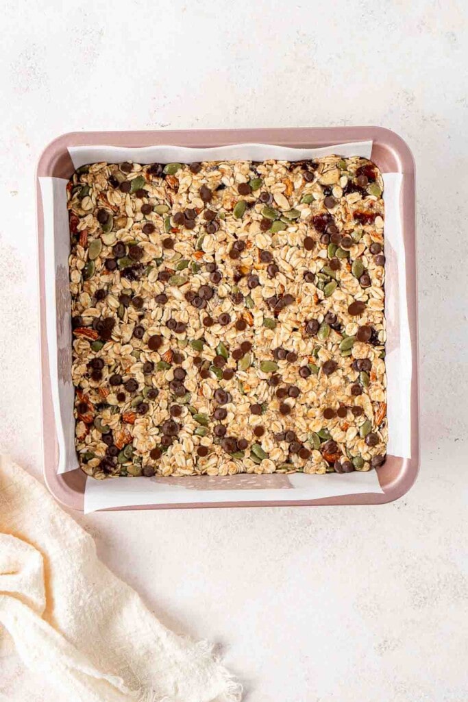 The granola bar mixture pressed into the baking pan.
