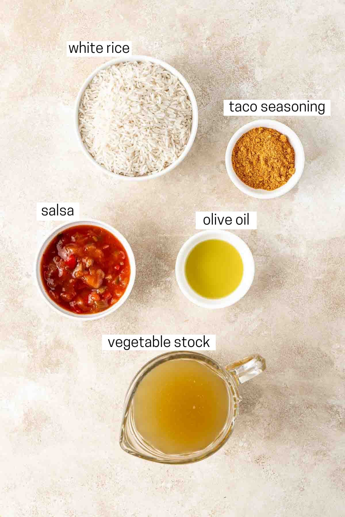 All ingredients needed to make Mexican rice in the rice cooker.