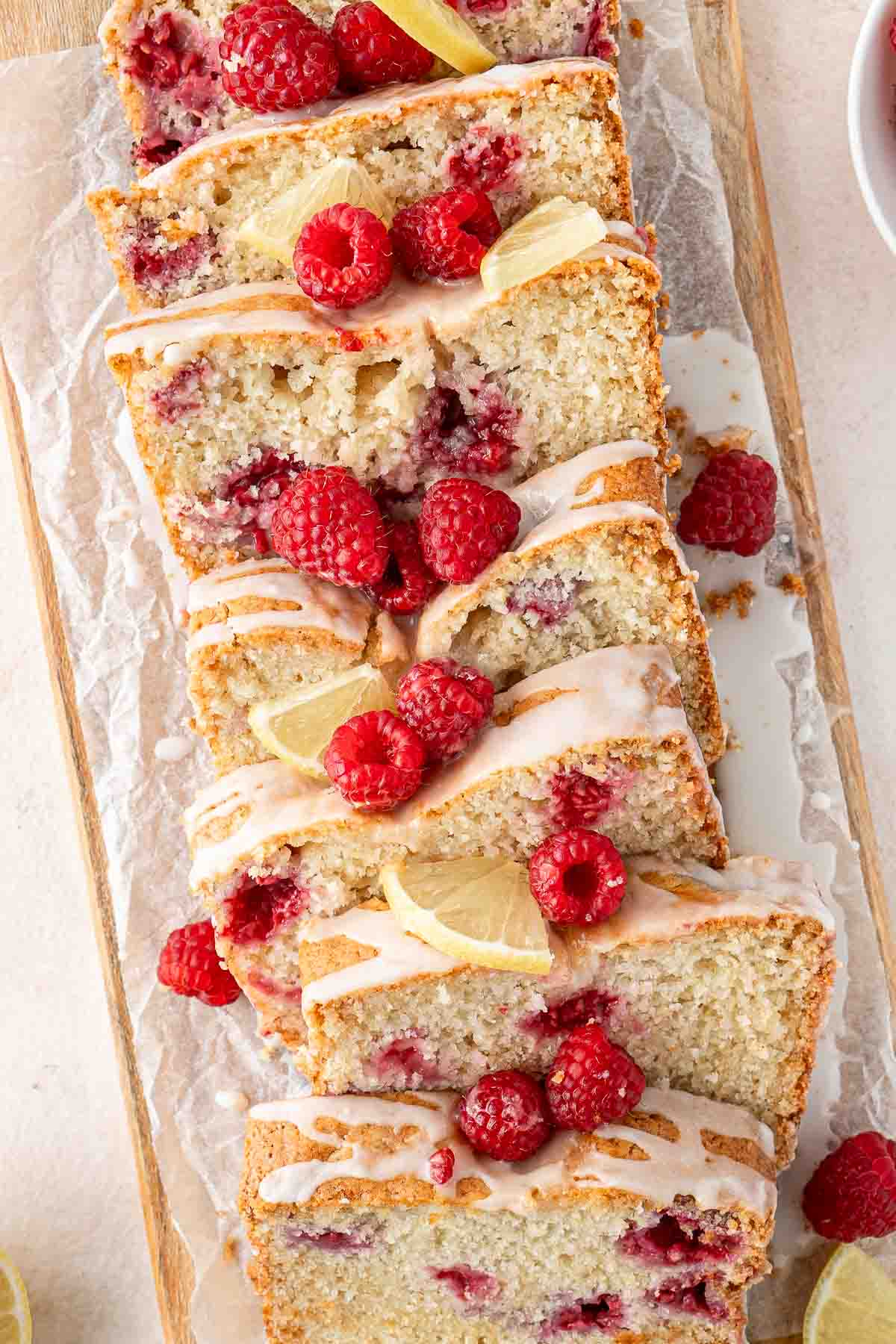 Vegan raspberry and lemon cake slices up ready to serve.