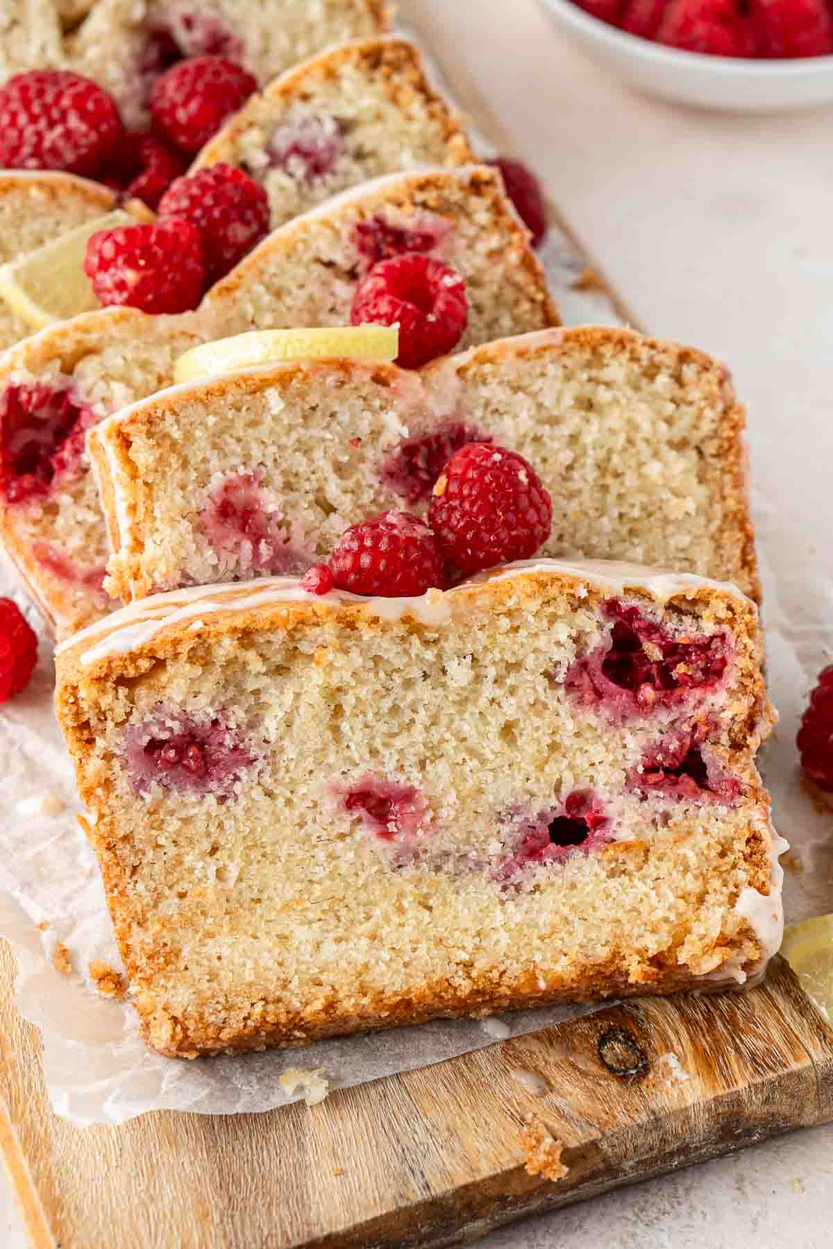 Close up of a slice of vegan raspberry lemon cake.