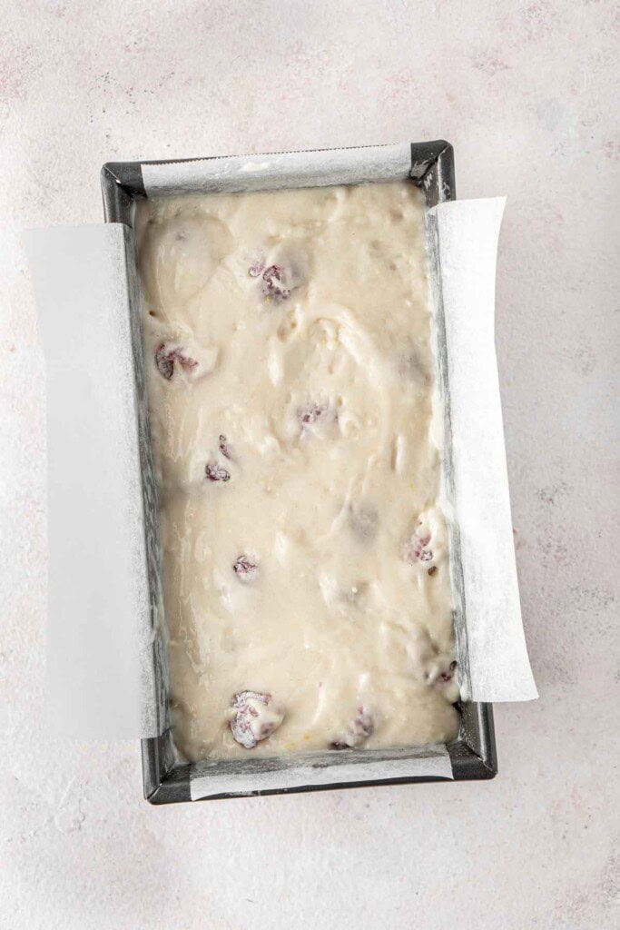 The cake batter in a baking pan ready for the oven.