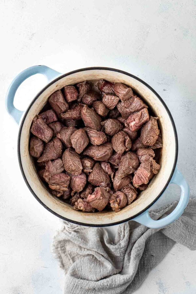 Browned beef in a dutch oven.