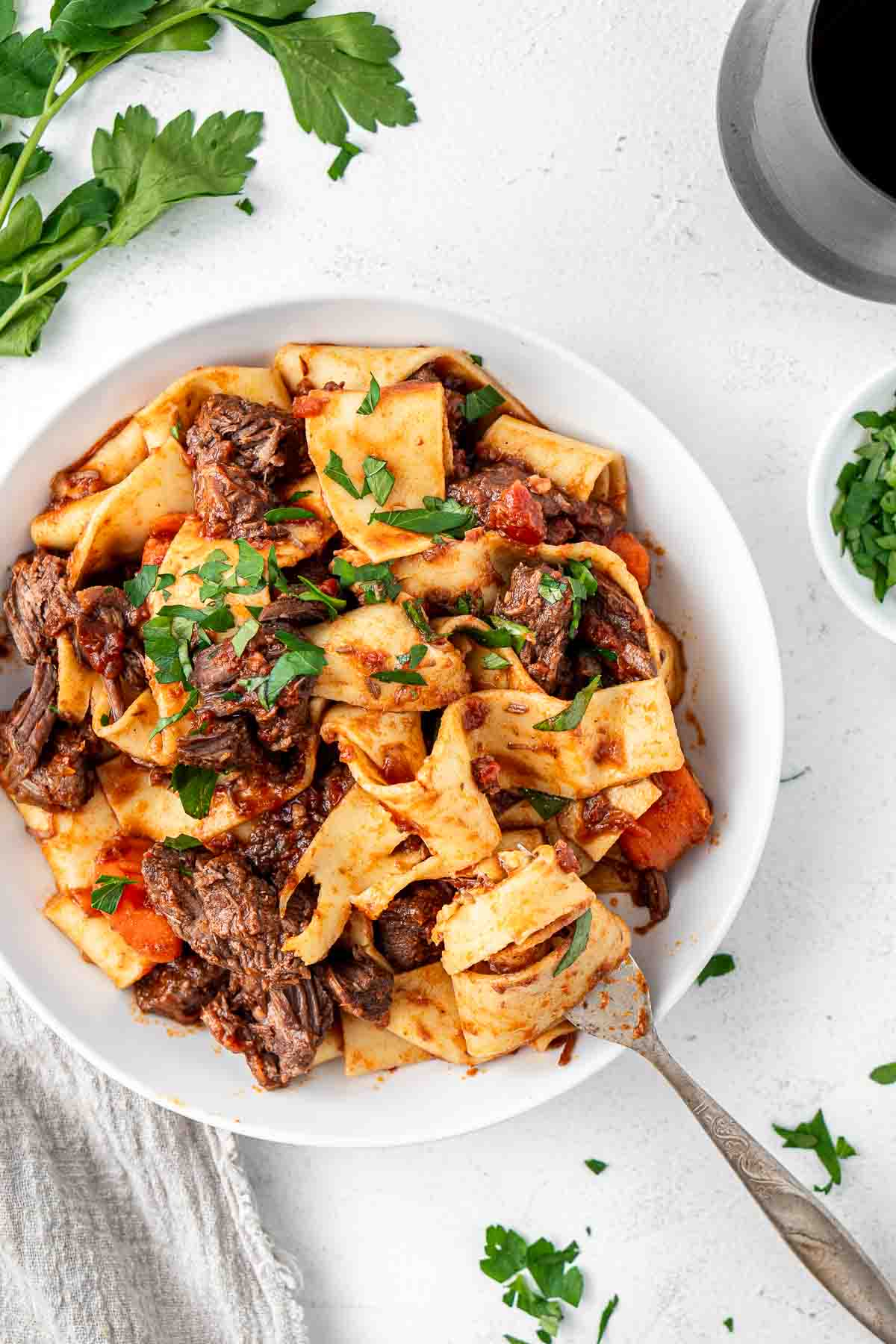 Beef ragu in a bowl with a fork.