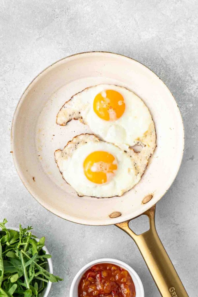 Fried eggs in a pan.