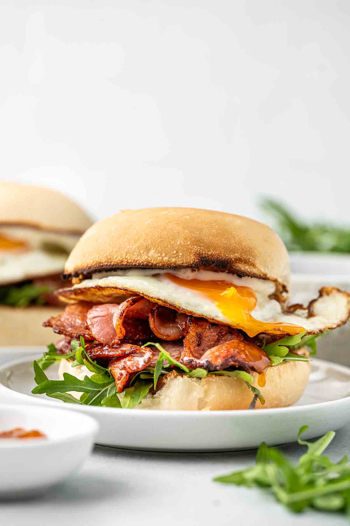 Bacon and egg roll on a plate.