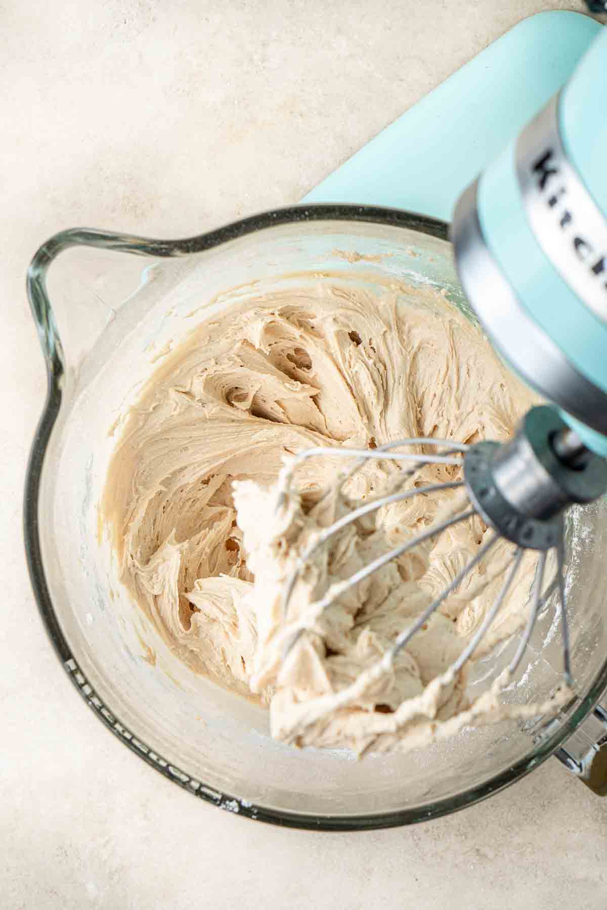 The biscoff buttercream in the stand mixer bowl.